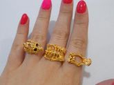 Anel triplo dourado caveira.